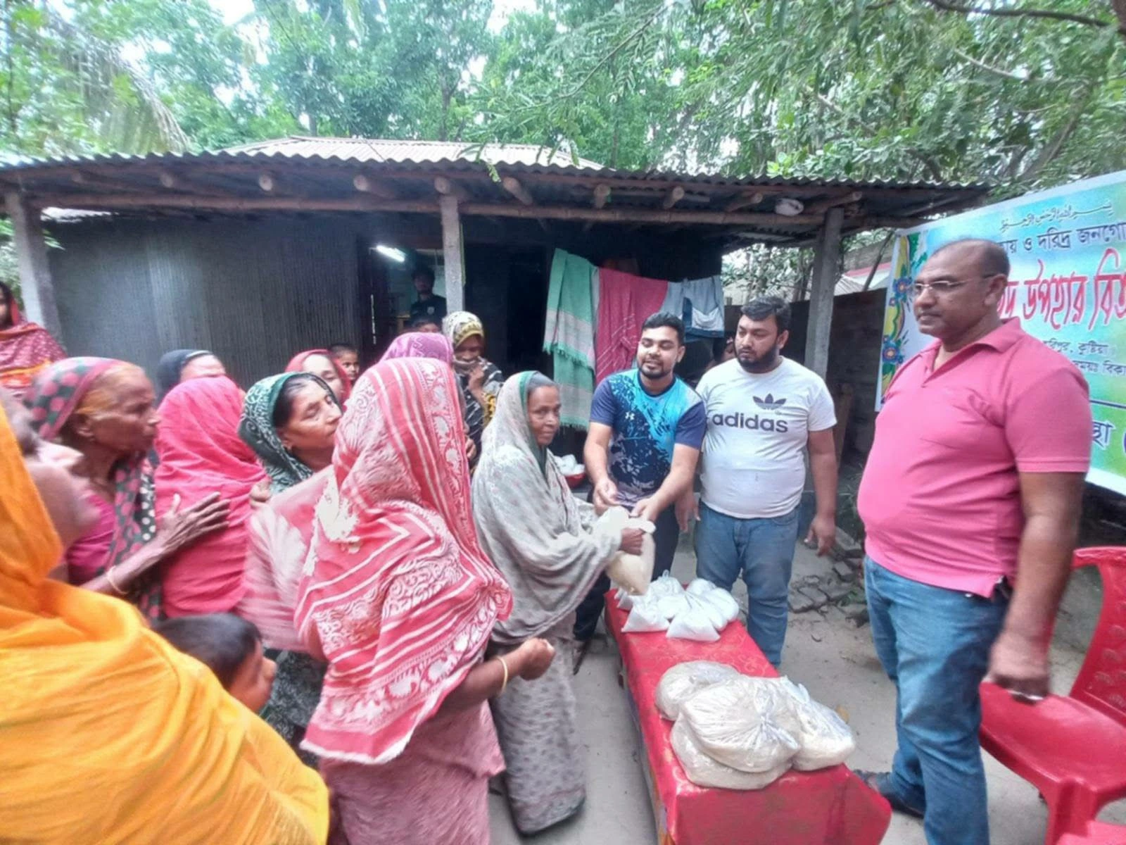 People receiving packaged supplies outdoors