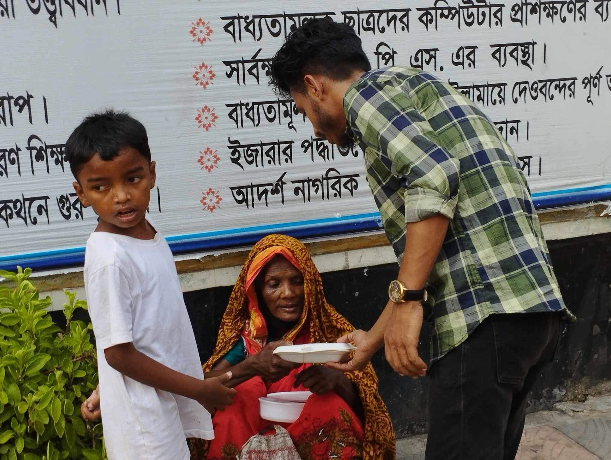 A woman receiving a package at a community gathering
