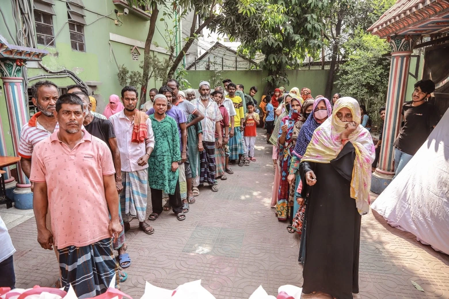 A queue of people outside a building