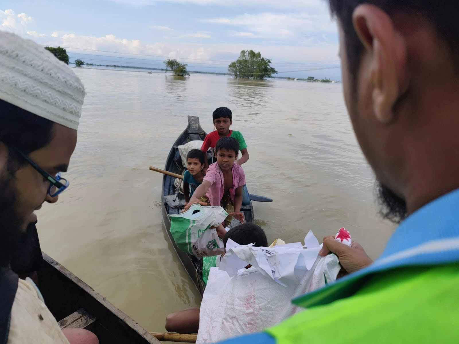 A boat carrying people and supplies on the water