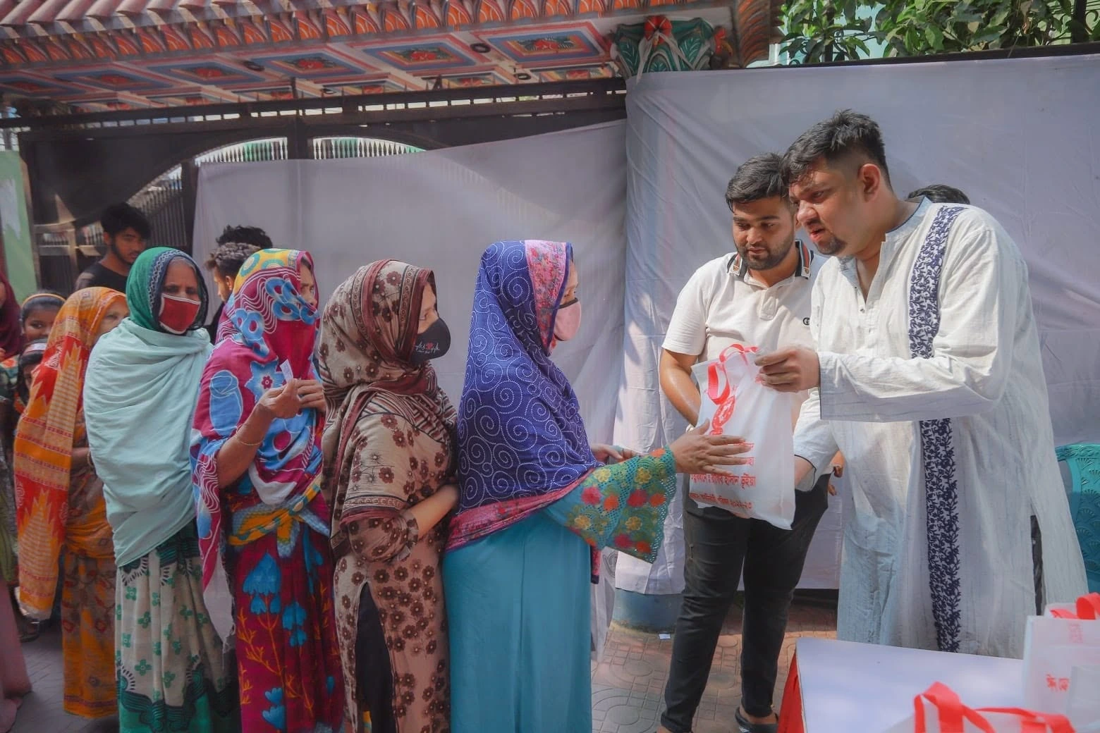 People receiving supplies at a community event